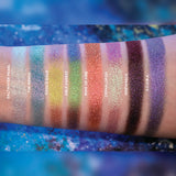 Arm swatches on fair skin tone of all 8 shadows included in the Deep Sea Treasures Palette. Left to right: Saltwater Pearl, The Bends, Fool's Gold, Kelp Forest, Ring of Fire, Cephalopod, Shipwreck and S.C.U.B.A.