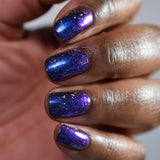 Close up shot of nails done with Sunken Treasure on medium skin tone
