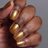 Close up shot of nails done with Embellishment Nail Lacquer on deep skin tone