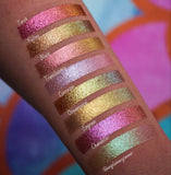 Left top angled arm swatches on fair skin tone of Torch Glitter Multichrome Eyeshadow shifts compared to Foiling, Blaze, Translucency, Corrosion, Ornamental, Engrave, Chandelier