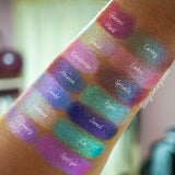 Top angled arm swatches on medium skin tone of Glitter Multichrome Bundle shifts