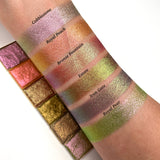 Top angled arm swatches on fair skin tone of Estate Earth Vibrant Multichrome Eyeshadow shifts compared to Cobblestone, Royal Peach, Bronze Fountain, Iron Gate and Royal Pear