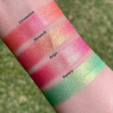 Top angled arm swatches on fair skin tone of Monarch Vibrant Multichrome Eyeshadow shifts compared to Coronation, Reign and Topiary