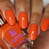 Close up of nails done with Lava Lamp nail lacquer on medium skin tone