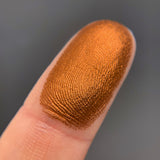 Chocolate Orange macro finger swatch.