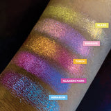 Low right angled arm swatches on deeo skin tone of Torch Glitter Multichrome Eyeshadow shifts compared to Blaze, Engrave, Glaziers Mark, Abrasion
