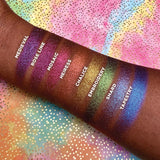 Top angled arm swatches on deep skin tone of Embroidery Hybrid Multichrome Eyeshadow featured in Hybrid Multichrome Eyeshadow Bundle with Medieval, Rose Line, Mosaic, Heiress, Chalice, Shard, Tapestry