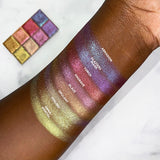 Top angled arm swatches on deep skin tone of Blaze Glitter Multichrome compared to Abrasion, Glaziers Mark, Torch, Engrave, Opulent, Foiling, Ornamental