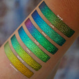 Right angled arm swatches on medium skin tone of Patina Jewelled Multichrome Eyeshadow shifts compared to Gargoyle, Castle, Anneal, Trefoil, Weathered