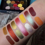 Top angled arm swatches on fair skin tone of The Harvest Moon Collection including Poinsettia Foiled Eyeshadow