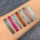 Top angled arm swatches on fair skin tone of Crystalline compared to Snowdrift, Permafrost, Char, Poinsettia, Bon Bon and Wormwood