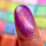 Close up finger swatch on fair skin tone of Noble Glitter Vibrant Multichrome Pigment