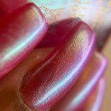 Close up left angled nails done with Dragontini Fruitlacquer on deep skin tone