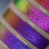 Right close up arm swatches on fair skin tone of Flame-Blown Jewelled Multichrome Eyeshadow compared to Smoulder, Gothic