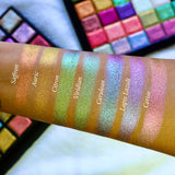 Straight angled arm swatches on medium skin tone of Lapis Lazuli Deep Iridescent Multichrome Eyeshadow shifts compared to Saffron, Auric, Citron, Viridian, Cerulean and Cerise