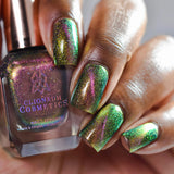 Close up of nails done with Synesthesia nail lacquer featuring a design to show off the magnetic effect on deep skin tone.