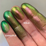 Right angled finger swatches on fair skin tone of Weld Jewelled Multichrome Eyeshadow shifts compared to Gargoyle
