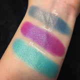 Top angled arm swatches on fair skin tone of Amulet Duochrome Eyeshadow compared to Fog, Clairvoyance 