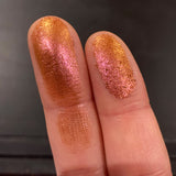 Close up finger swatches of Torch Glitter Multichrome Eyeshadow