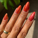 Close up shot of nails done with Ring of Fire on medium skin tone.