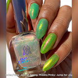 Close up shot of nails done with Joys of Spring and Jump for Joy Nail Lacquers over a green base on medium skin tone.