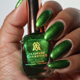 Close up shot of Appletini Nail Lacquer as applied to darker skin tone with nail lacquer bottle