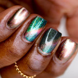 Close up shot of nails done with Baeocystin Nail Lacquer on deep skin tone.