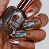 Close up shot of nails done with Baeocystin Nail Lacquer on deep skin tone.