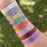 Arm swatches on fair skin tone of all 8 shadows included in the Deep Sea Treasures Palette. Top to bottom: Saltwater Pearl, The Bends, Fool's Gold, Kelp Forest, Ring of Fire, Cephalopod, Shipwreck and S.C.U.B.A.