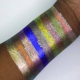 Arm swatches on deep skin tone of Incandescence, Alloy, Exothermic, Dais, Masonry, Tiara, Ascension, Archway and Electron.