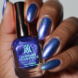 Close-up shot of Gin & Tonic nail lacquer applied to finger nails on a darker skin tone, with nail lacquer bottle in hand