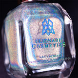 Close-up, angled shot of H₂Olo Nail Lacquer bottle on a black background.