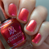 Close-up of nails painted with La Vie En Rose Nail Lacquer on fair skin tone. Hand is holding polish bottle.