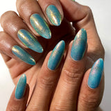 Top angled shot of nails done with Love Letter Nail Lacquer on medium skin tone.