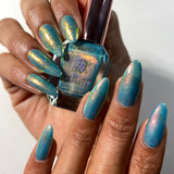 Top angled shot of nails done with Love Letter Nail Lacquer on medium skin tone.