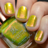 Close-up shot of Spicy Margarita nail lacquer applied to finger nails, with nail lacquer bottle in hand