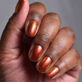 Close up shot of nails done with Ring of Fire on deep skin tone