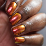 Close up shot of nails done with Ring of Fire on deep skin tone