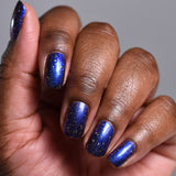 Close up shot of nails done with Sunken Treasure on deep skin tone