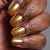Close up shot of nails done with Embellishment Nail Lacquer on deep skin tone