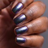 Close up shot of nails done with Oxidize Nail Lacquer on deep skin tone