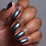 Close up shot of nails done with Oxidize Nail Lacquer on deep skin tone
