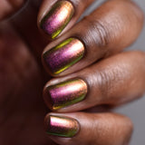 Close up shot of nails done with Smoulder Lite Nail Lacquer on deep skin tone