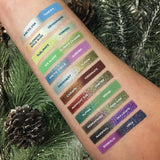 Top angled arm swatches on fair skin tone of 66.5 N Collection including Permafrost Duochrome Eyeshadow