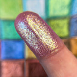 Close up finger swatch of Adornment Glitter Multichrome Pigment