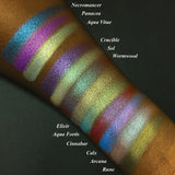 Top angled arm swatches on deep skin tone of Panacea Duochrome Eyeshadow amongst the Witchcraft vs. Alchemy Collection