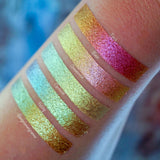 Right angled arm swatches on fair skin tone of Ornamental Glitter Multichrome Eyeshadow shifts compared to Torch, Blaze, Corrosion, Foiling