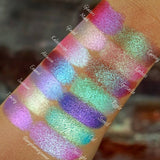 Top angled arm swatches on medium skin tone of Emboss Glitter Multichrome Eyeshadow shifts compared to Glaziers Mark, Glazed, Kaleidoscope, Enamel, Abrasion, Sunbeam, Tracery, Carving, Grisaille, Ripple, Stencil, Ciel, Spotlight