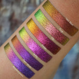 Right angled arm swatches on medium skin tone of Gothic Jewelled Multichrome Eyeshadow shifts compared to Sand Blast, Forge, Kiln, Smoulder, Flame- Blown