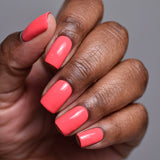 Close up shot of nails done with Blossom Nail Lacquer on deep skin tone.
